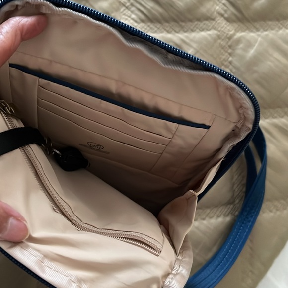 Traveling Blue cross body anti theft travel bag. - Picture 3 of 4